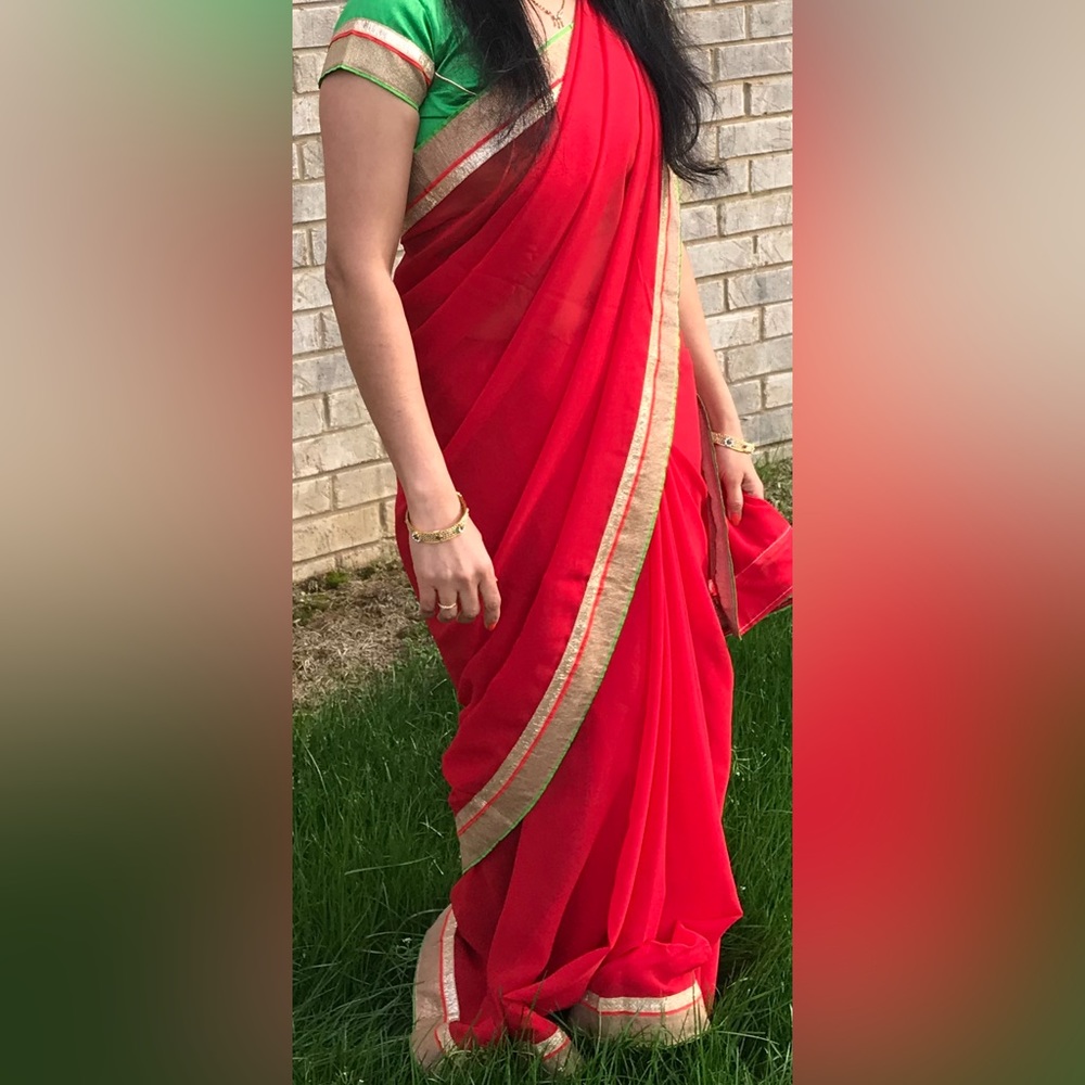 Red saree with blouse. Indian outfit for wedding. Saree blouse. Diwali